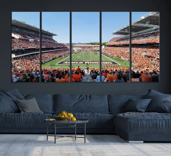 The Oregon State Beavers Football Team Print, featuring a vibrant depiction of Corvallis Reser Stadium on museum-quality canvas, adorns the room.