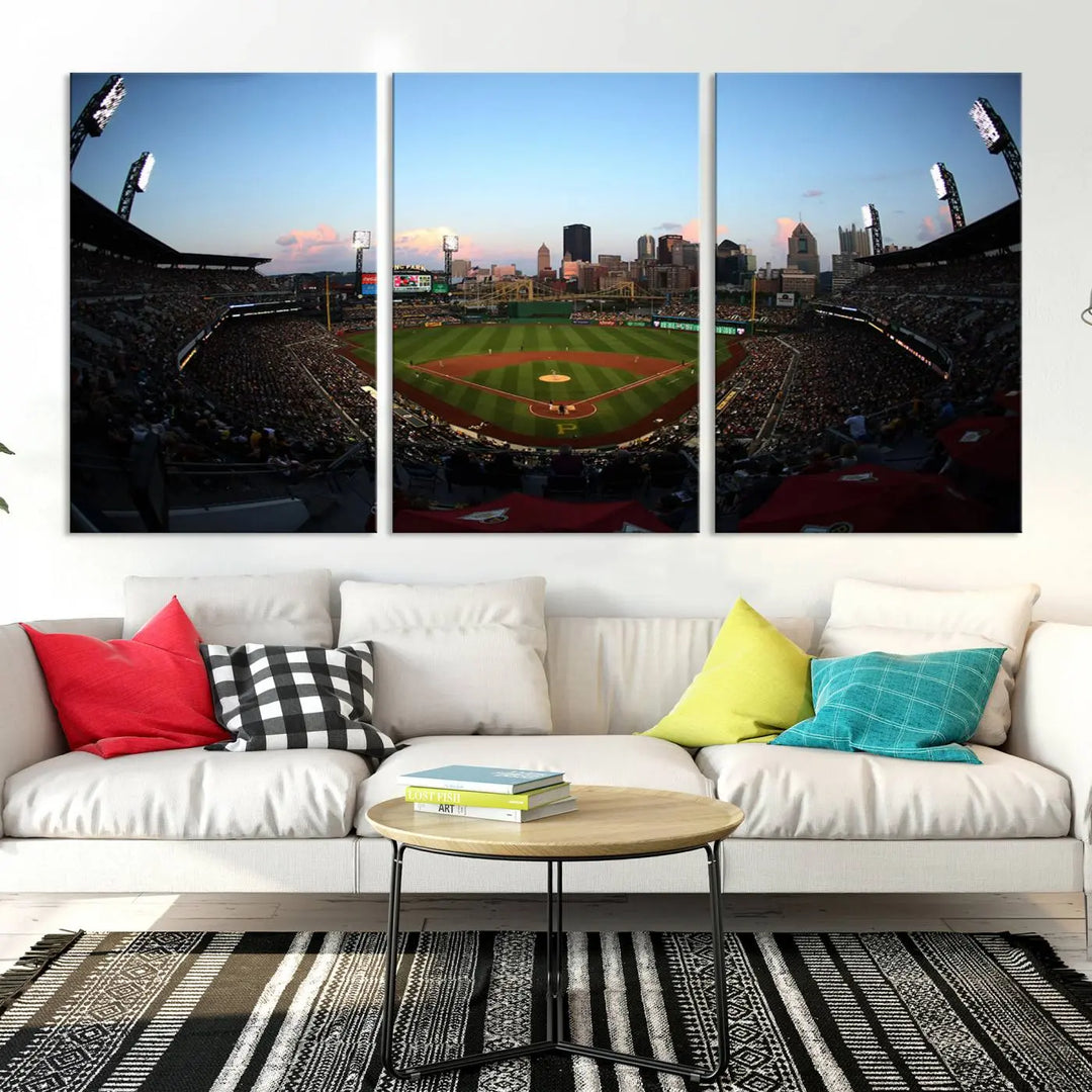 The "PNC Park Evening Game Triple Canvas Wall Art" showcases a bustling PNC Park, home to the Pittsburgh Pirates. This artwork beautifully captures the vibrant energy of Major League Baseball.