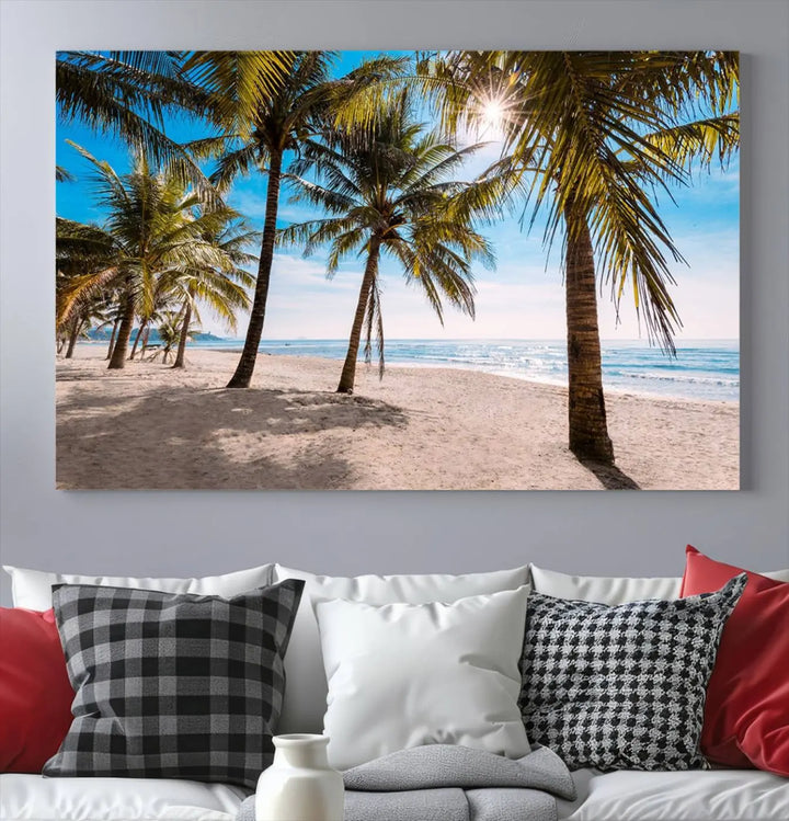 A living room showcasing the Palm Beach Tropical Island Wall Art Canvas Print, a triptych of palm trees on a sandy beach, offered in museum-quality canvas.