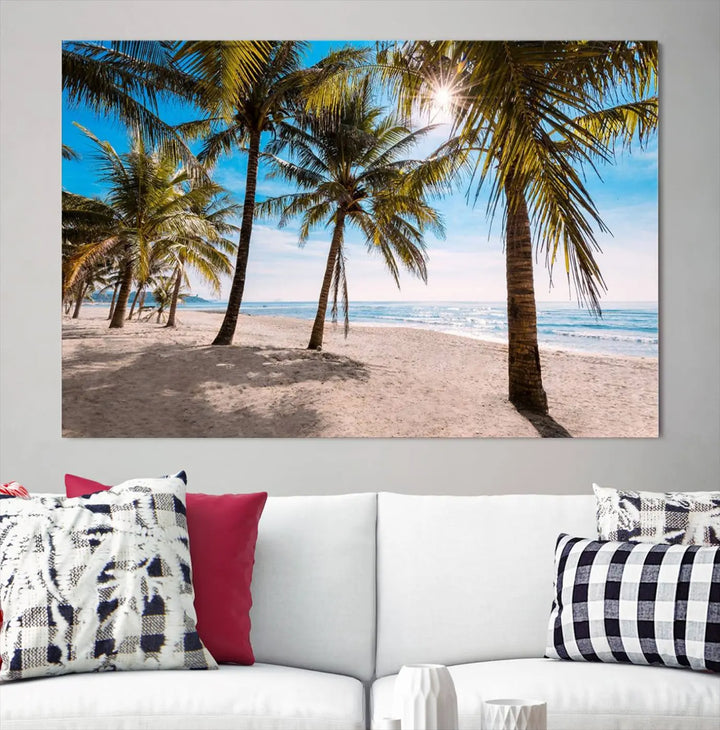 A living room showcasing the Palm Beach Tropical Island Wall Art Canvas Print, a triptych of palm trees on a sandy beach, offered in museum-quality canvas.