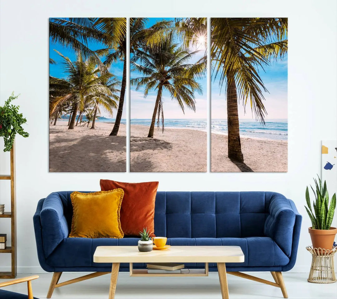 A living room showcasing the Palm Beach Tropical Island Wall Art Canvas Print, a triptych of palm trees on a sandy beach, offered in museum-quality canvas.