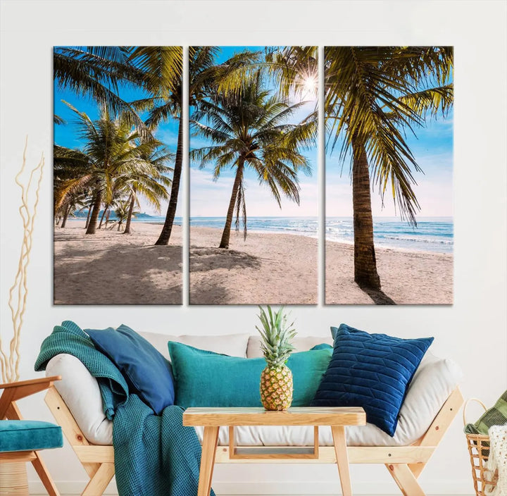 A living room showcasing the Palm Beach Tropical Island Wall Art Canvas Print, a triptych of palm trees on a sandy beach, offered in museum-quality canvas.