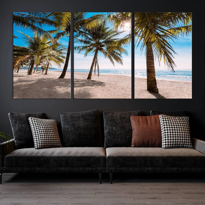 A living room showcasing the Palm Beach Tropical Island Wall Art Canvas Print, a triptych of palm trees on a sandy beach, offered in museum-quality canvas.