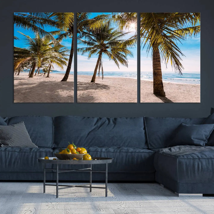 A living room showcasing the Palm Beach Tropical Island Wall Art Canvas Print, a triptych of palm trees on a sandy beach, offered in museum-quality canvas.