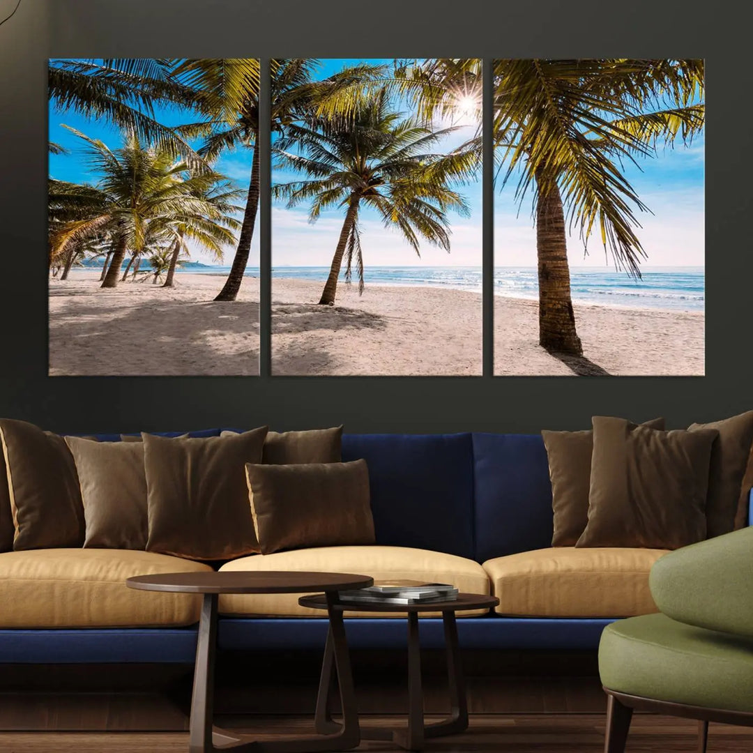 A living room showcasing the Palm Beach Tropical Island Wall Art Canvas Print, a triptych of palm trees on a sandy beach, offered in museum-quality canvas.