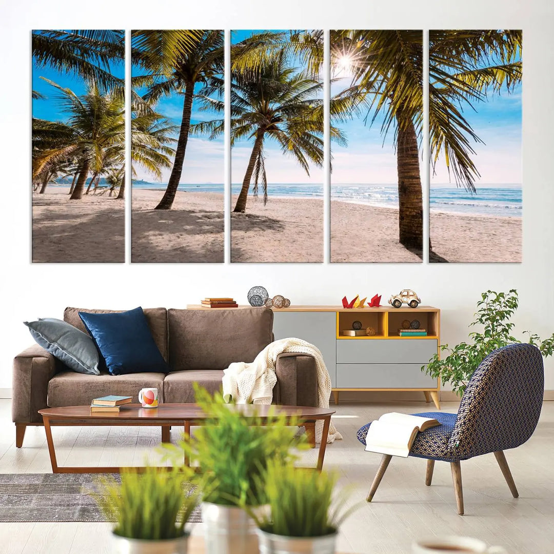 A living room showcasing the Palm Beach Tropical Island Wall Art Canvas Print, a triptych of palm trees on a sandy beach, offered in museum-quality canvas.