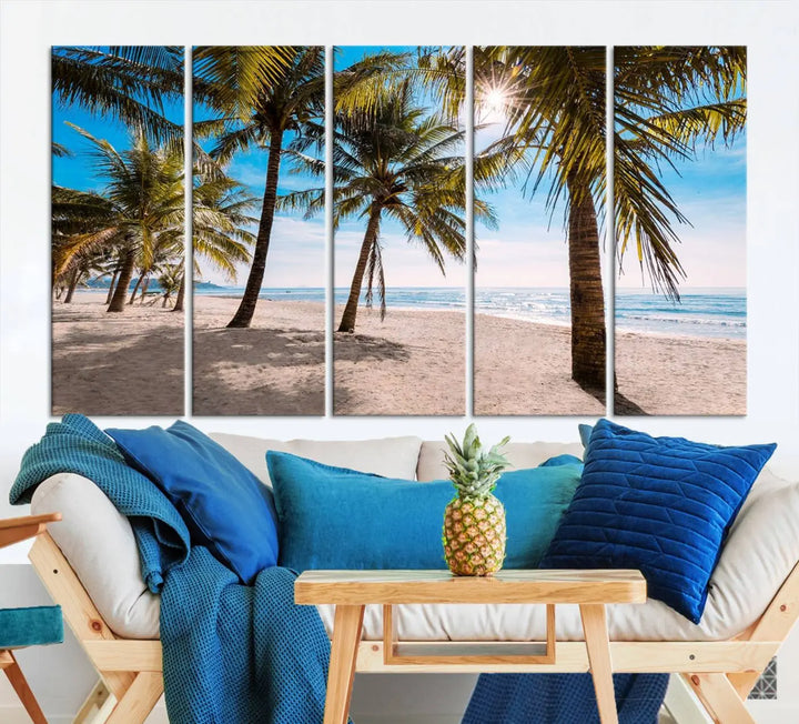 A living room showcasing the Palm Beach Tropical Island Wall Art Canvas Print, a triptych of palm trees on a sandy beach, offered in museum-quality canvas.