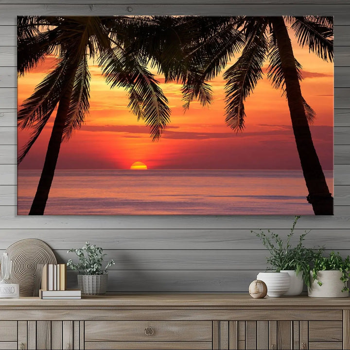 The living room features the "Palm Sunset Sea Ocean Beach Wall Art Canvas Print, Framed Ready to Hang" above the sofa.