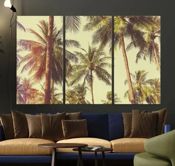 The living room features the Palm Tree Wall Art Tropical Coast Canvas Print, displayed as a triptych on museum-quality canvas. Each piece is gallery wrapped for a polished look.