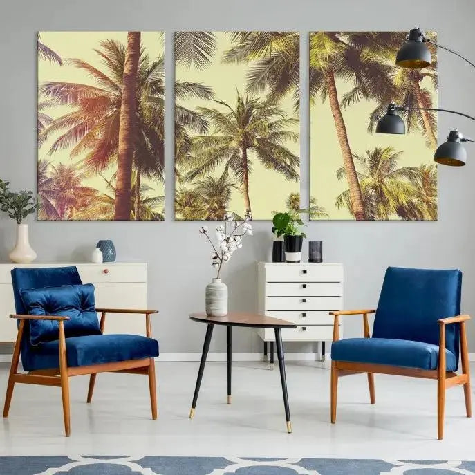 The living room features the Palm Tree Wall Art Tropical Coast Canvas Print, displayed as a triptych on museum-quality canvas. Each piece is gallery wrapped for a polished look.