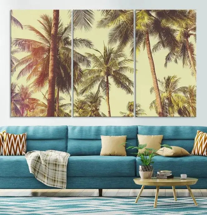 The living room features the Palm Tree Wall Art Tropical Coast Canvas Print, displayed as a triptych on museum-quality canvas. Each piece is gallery wrapped for a polished look.