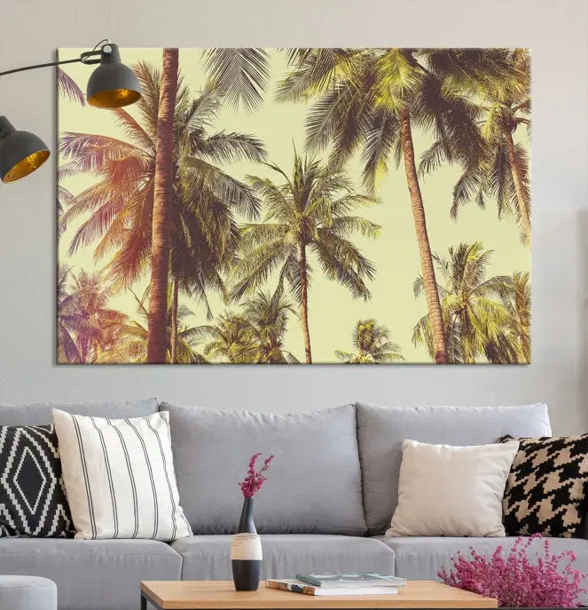 The living room features the Palm Tree Wall Art Tropical Coast Canvas Print, displayed as a triptych on museum-quality canvas. Each piece is gallery wrapped for a polished look.