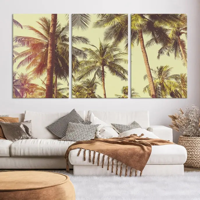 The living room features the Palm Tree Wall Art Tropical Coast Canvas Print, displayed as a triptych on museum-quality canvas. Each piece is gallery wrapped for a polished look.