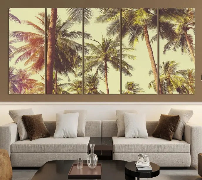 The living room features the Palm Tree Wall Art Tropical Coast Canvas Print, displayed as a triptych on museum-quality canvas. Each piece is gallery wrapped for a polished look.