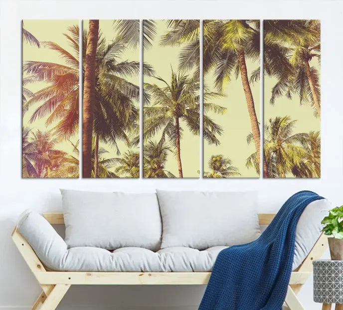 The living room features the Palm Tree Wall Art Tropical Coast Canvas Print, displayed as a triptych on museum-quality canvas. Each piece is gallery wrapped for a polished look.