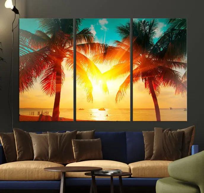 The Palm and Sunset Beach Wall Art Canvas Print is a gallery-wrapped triptych depicting a tropical sunset with palm trees on museum-quality canvas and finished with a UV-protective coating.