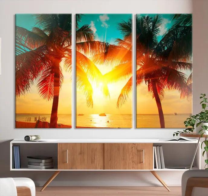 The Palm and Sunset Beach Wall Art Canvas Print is a gallery-wrapped triptych depicting a tropical sunset with palm trees on museum-quality canvas and finished with a UV-protective coating.