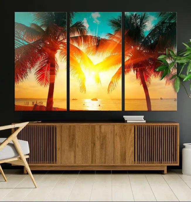 The Palm and Sunset Beach Wall Art Canvas Print is a gallery-wrapped triptych depicting a tropical sunset with palm trees on museum-quality canvas and finished with a UV-protective coating.