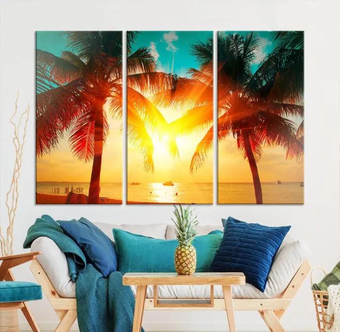 The Palm and Sunset Beach Wall Art Canvas Print is a gallery-wrapped triptych depicting a tropical sunset with palm trees on museum-quality canvas and finished with a UV-protective coating.