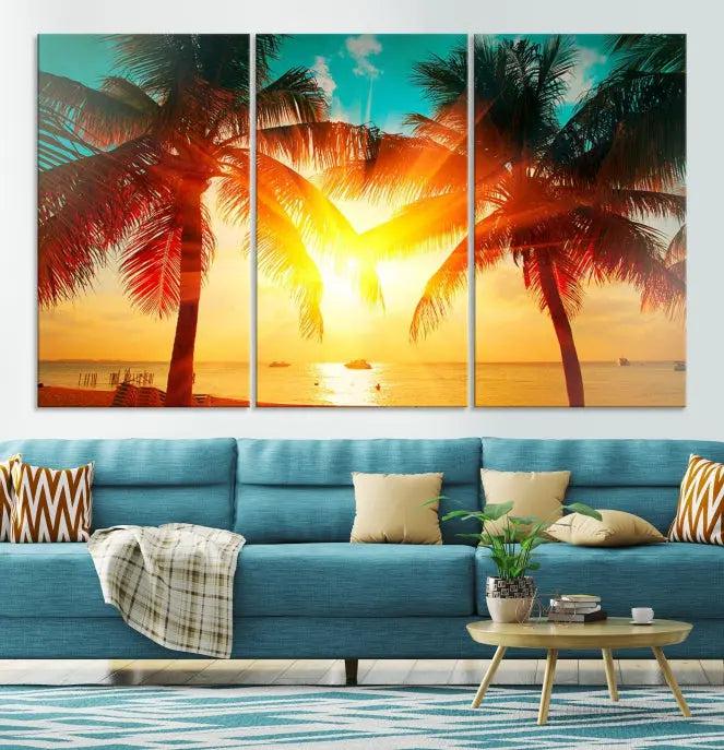 The Palm and Sunset Beach Wall Art Canvas Print is a gallery-wrapped triptych depicting a tropical sunset with palm trees on museum-quality canvas and finished with a UV-protective coating.