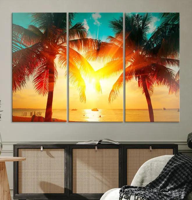 The Palm and Sunset Beach Wall Art Canvas Print is a gallery-wrapped triptych depicting a tropical sunset with palm trees on museum-quality canvas and finished with a UV-protective coating.