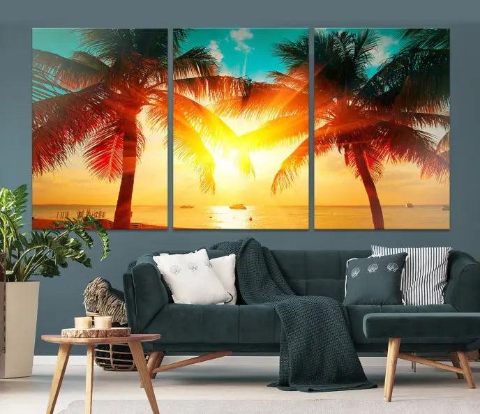 The Palm and Sunset Beach Wall Art Canvas Print is a gallery-wrapped triptych depicting a tropical sunset with palm trees on museum-quality canvas and finished with a UV-protective coating.