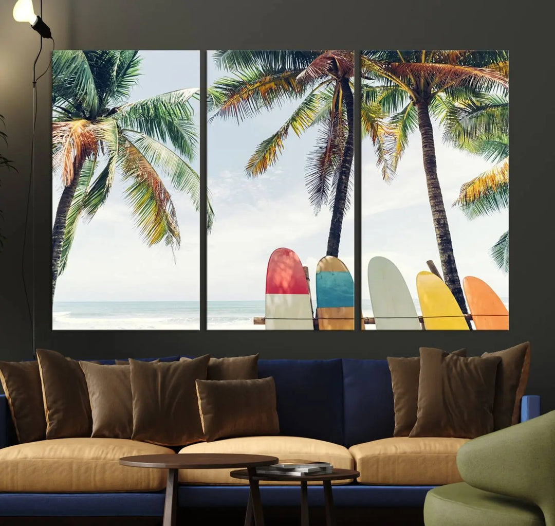 The room showcases The Palm and Surfing Board Wall Art Canvas Print, a triptych of palm trees and surfboards by the beach, elegantly gallery wrapped for a sophisticated finish.