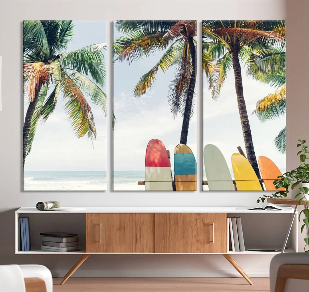 The room showcases The Palm and Surfing Board Wall Art Canvas Print, a triptych of palm trees and surfboards by the beach, elegantly gallery wrapped for a sophisticated finish.