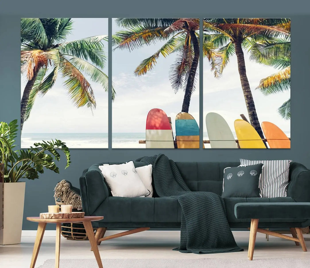 The room showcases The Palm and Surfing Board Wall Art Canvas Print, a triptych of palm trees and surfboards by the beach, elegantly gallery wrapped for a sophisticated finish.