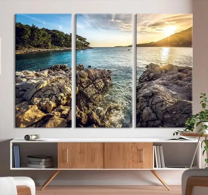 The Paradise Island on Seychelles Wall Art Canvas Print, a triptych capturing a coastal sunset over rocky cliffs and printed on museum-quality canvas with a UV-protective coating, hangs prominently.