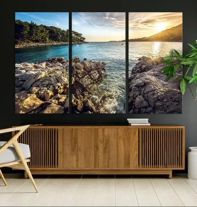 The Paradise Island on Seychelles Wall Art Canvas Print, a triptych capturing a coastal sunset over rocky cliffs and printed on museum-quality canvas with a UV-protective coating, hangs prominently.