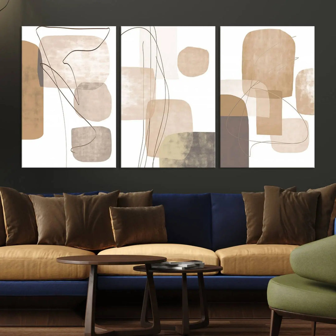 Pastel Boho Wall Art Canvas Print Set Mid-Century Prints featuring abstract art with beige and brown shapes adorns a dark wall, gallery wrapped for a sleek look.