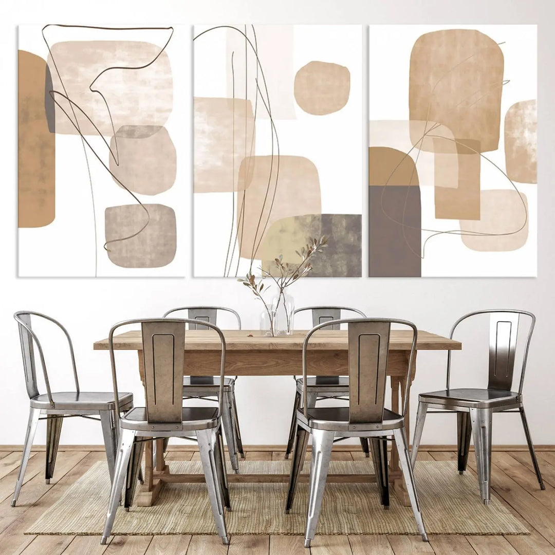 Pastel Boho Wall Art Canvas Print Set Mid-Century Prints featuring abstract art with beige and brown shapes adorns a dark wall, gallery wrapped for a sleek look.