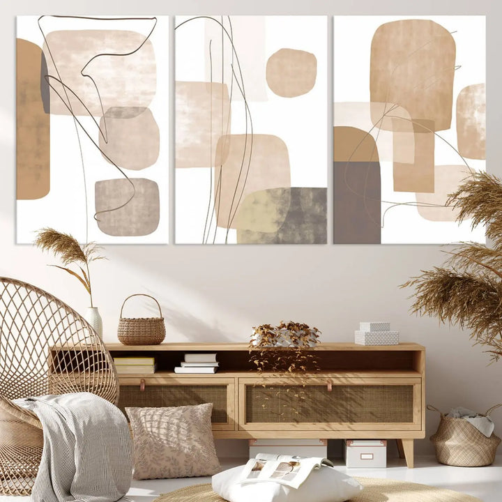 Pastel Boho Wall Art Canvas Print Set Mid-Century Prints featuring abstract art with beige and brown shapes adorns a dark wall, gallery wrapped for a sleek look.