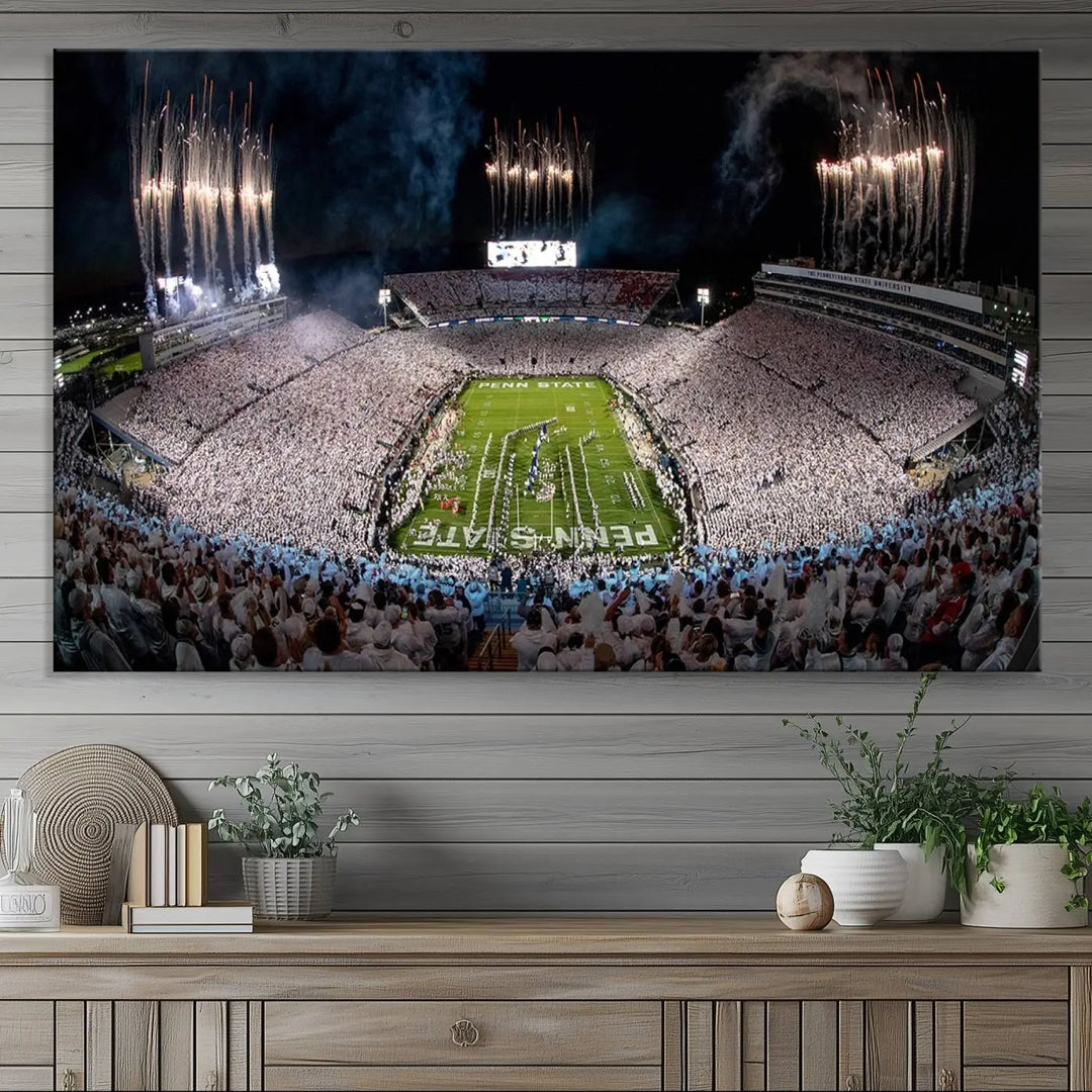 The Penn Stadium Football Wall Art Canvas Print captures the thrill of fireworks and fans in white at a college football game.