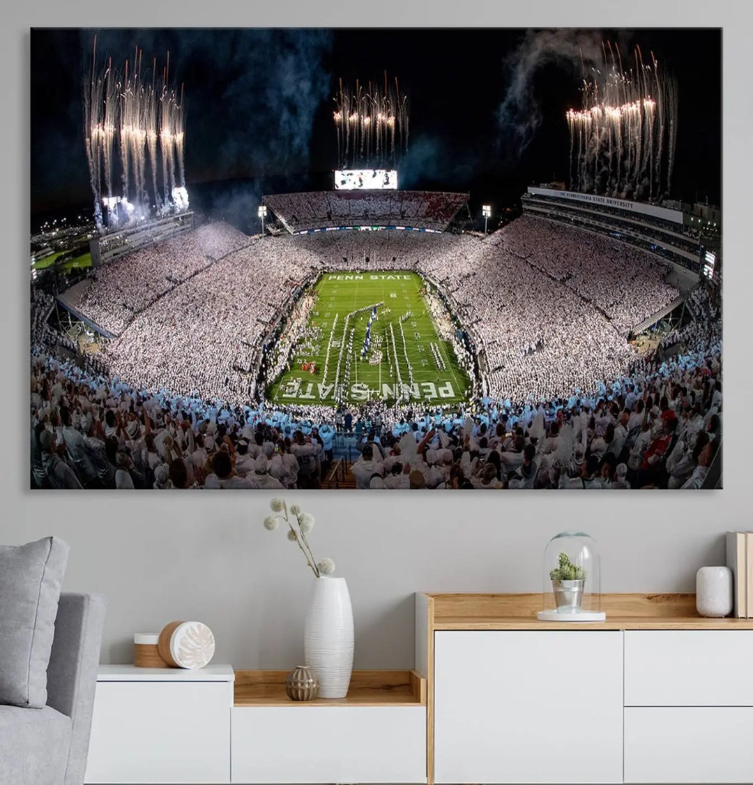 The Penn Stadium Football Wall Art Canvas Print captures the thrill of fireworks and fans in white at a college football game.