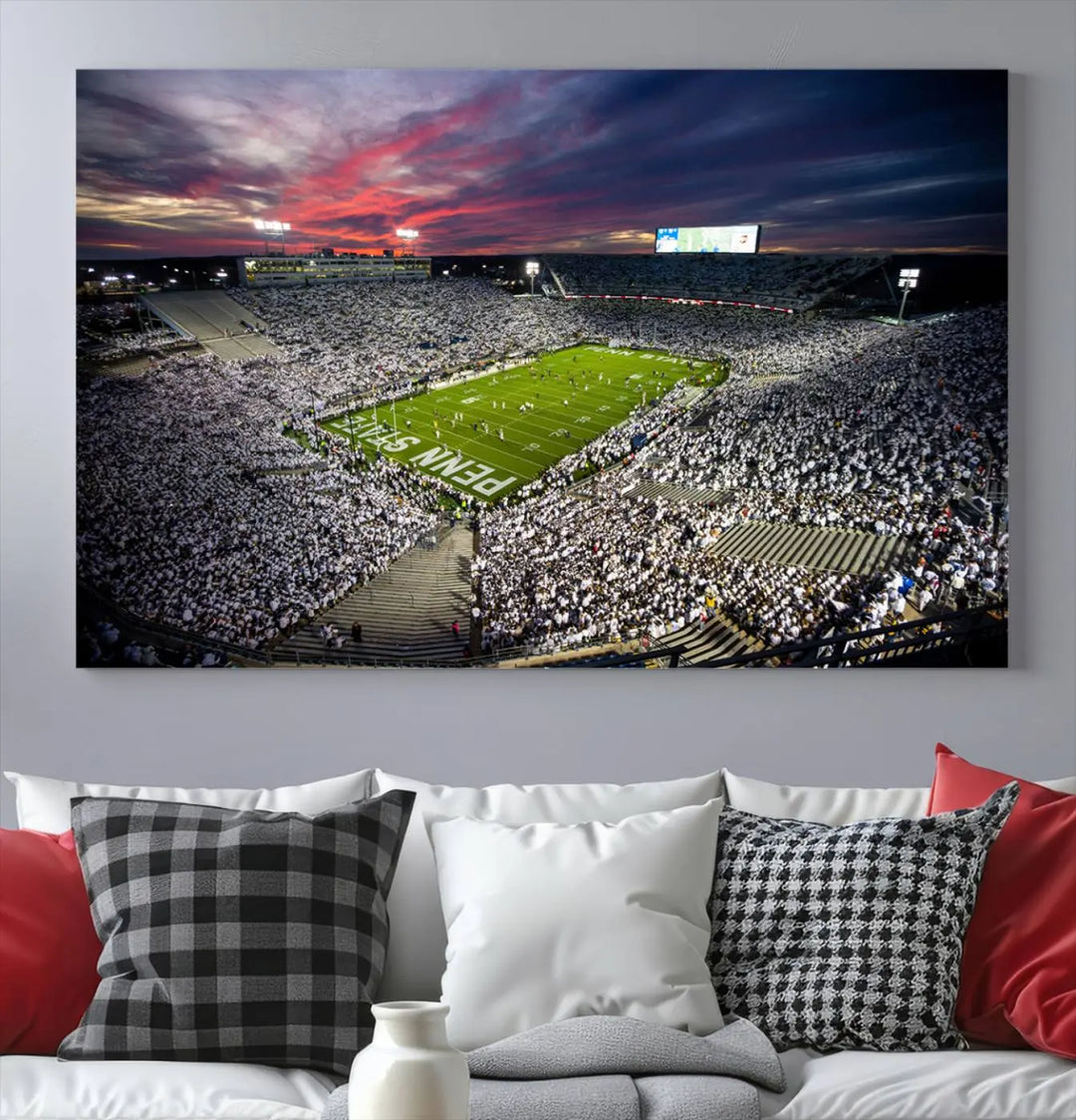 The living room features a breathtaking triptych canvas titled "Penn State Nittany Lions Football Team Print - University Park Beaver Stadium Wall Art Canvas Print," depicting a stadium at sunset. This gallery-quality finish is sure to elevate the aesthetic of any space.