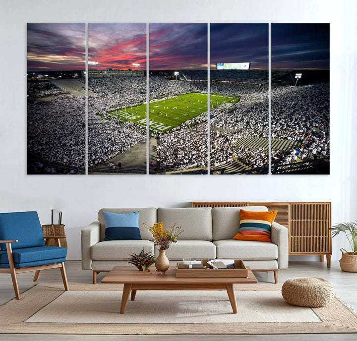 The living room features a breathtaking triptych canvas titled "Penn State Nittany Lions Football Team Print - University Park Beaver Stadium Wall Art Canvas Print," depicting a stadium at sunset. This gallery-quality finish is sure to elevate the aesthetic of any space.