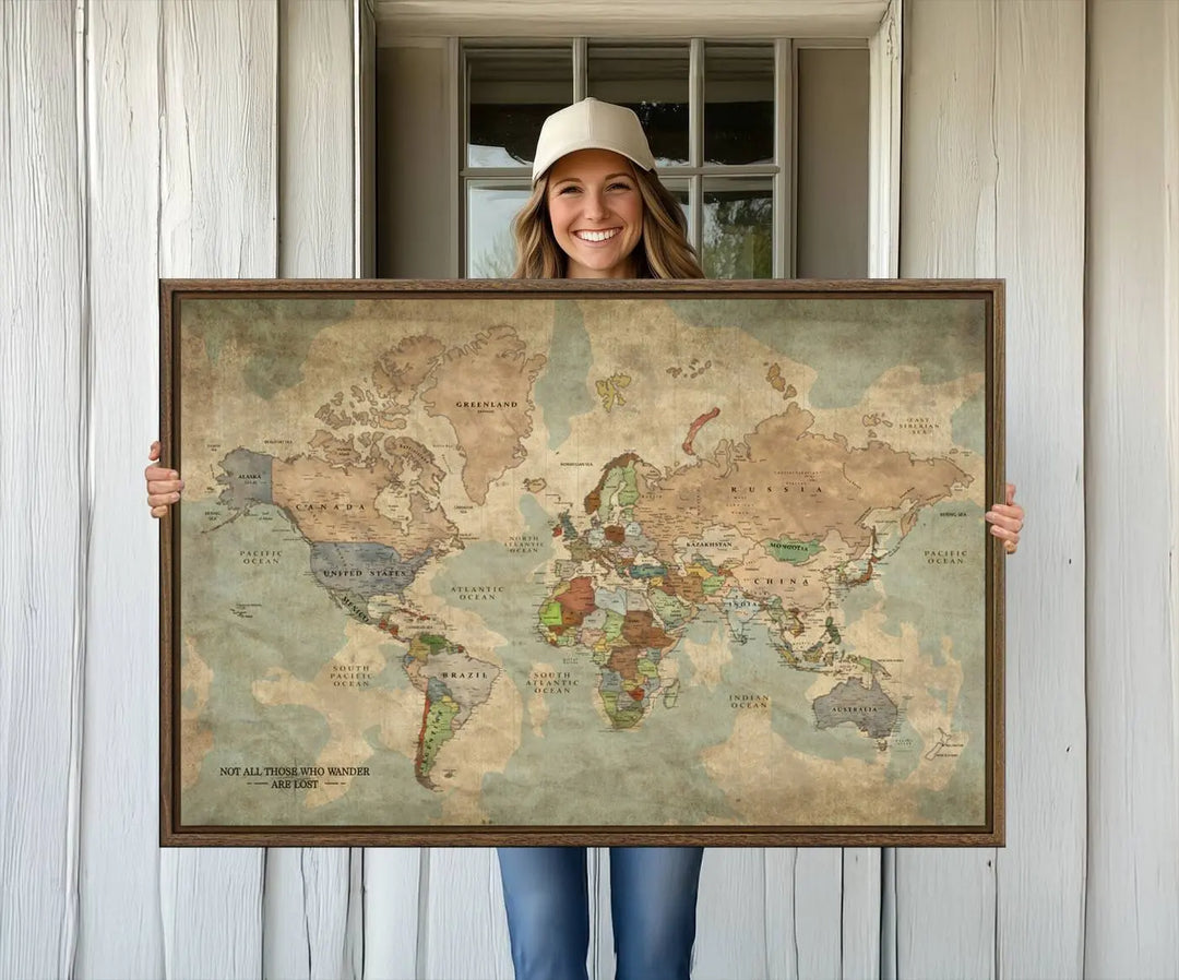 A Personalized World Map Canvas Print—a customized wall art map print—is displayed in front of a wooden wall, adding a touch of personalized home decor to the setting.