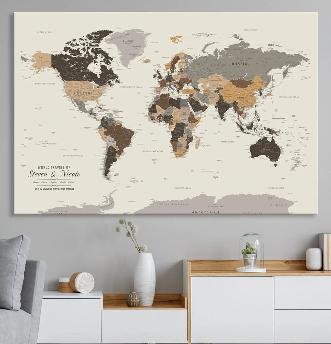 A large framed Personalized World Map Wall Art Canvas Print features custom text at the bottom, perfect for travel and exploration enthusiasts.