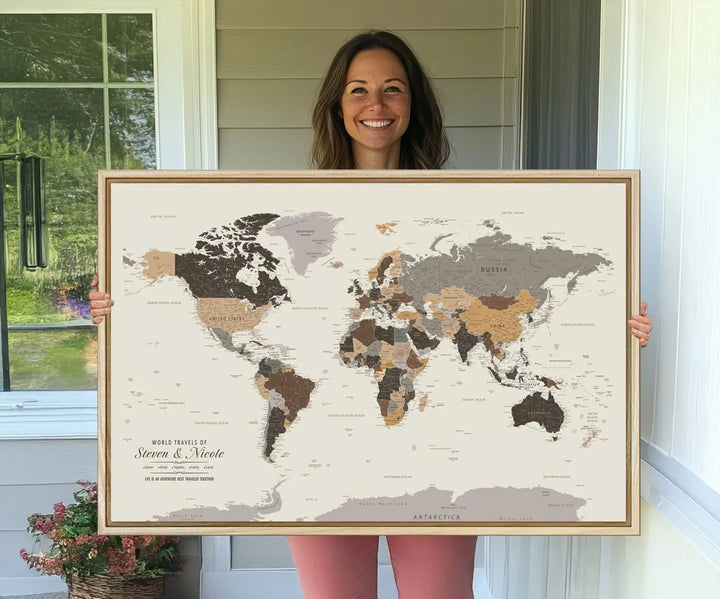 A large framed Personalized World Map Wall Art Canvas Print features custom text at the bottom, perfect for travel and exploration enthusiasts.