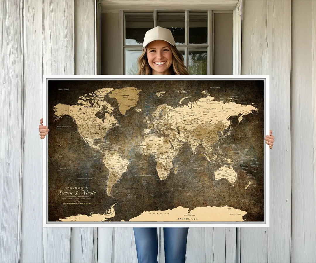 A woman beams with joy as she holds a large framed Personalized World Map Wall Art, capturing the essence of adventure and wanderlust.