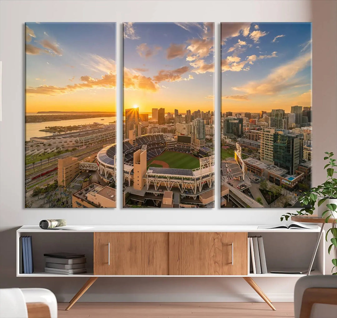 This Petco Park Sunset Triple Canvas Wall Art beautifully captures a vibrant San Diego cityscape at sunset, showcasing the iconic glow of Petco Park and high-rise buildings against a colorful sky.