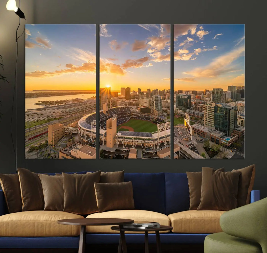 This Petco Park Sunset Triple Canvas Wall Art beautifully captures a vibrant San Diego cityscape at sunset, showcasing the iconic glow of Petco Park and high-rise buildings against a colorful sky.