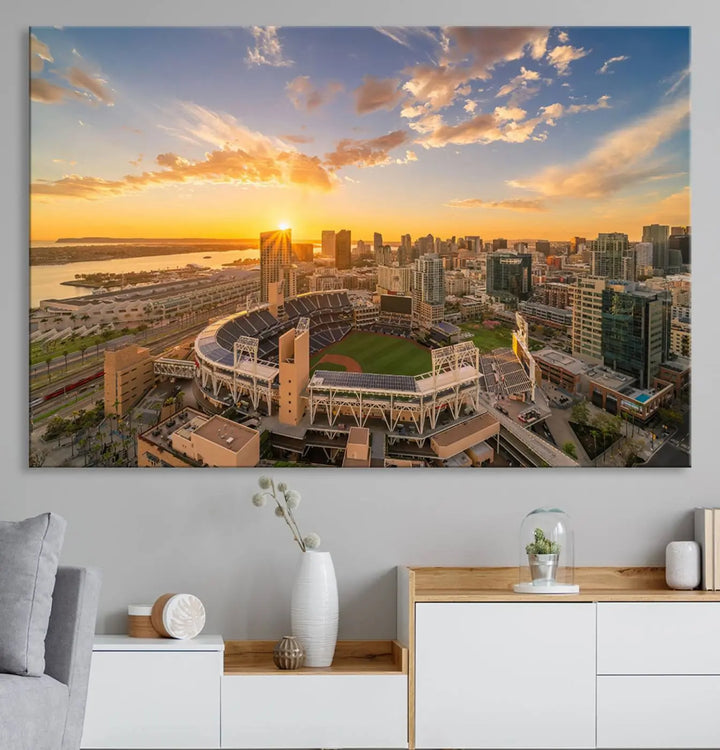 This Petco Park Sunset Triple Canvas Wall Art beautifully captures a vibrant San Diego cityscape at sunset, showcasing the iconic glow of Petco Park and high-rise buildings against a colorful sky.