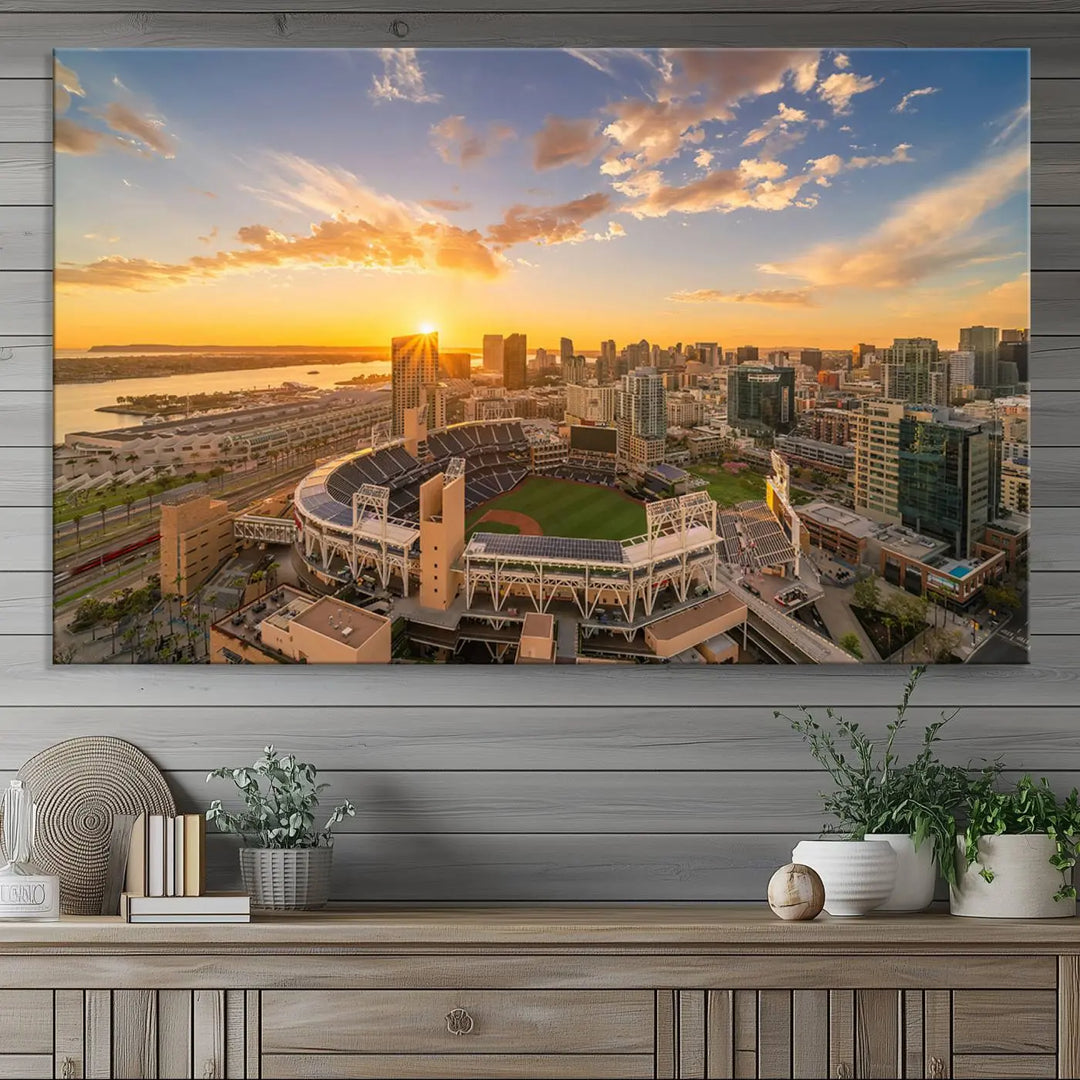 This Petco Park Sunset Triple Canvas Wall Art beautifully captures a vibrant San Diego cityscape at sunset, showcasing the iconic glow of Petco Park and high-rise buildings against a colorful sky.