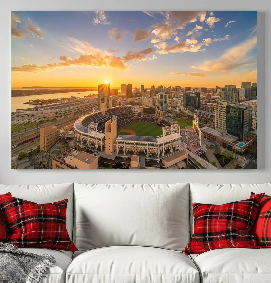 This Petco Park Sunset Triple Canvas Wall Art beautifully captures a vibrant San Diego cityscape at sunset, showcasing the iconic glow of Petco Park and high-rise buildings against a colorful sky.