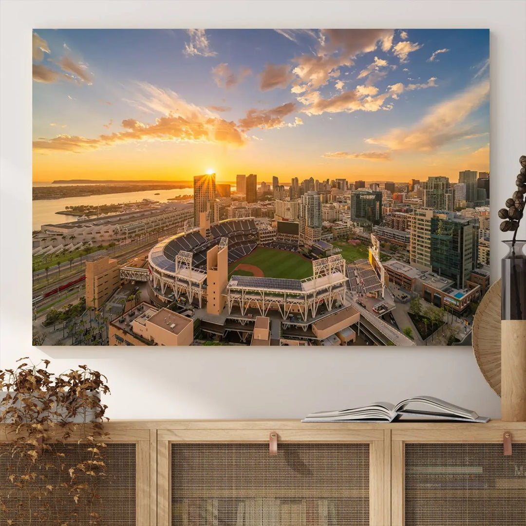 This Petco Park Sunset Triple Canvas Wall Art beautifully captures a vibrant San Diego cityscape at sunset, showcasing the iconic glow of Petco Park and high-rise buildings against a colorful sky.