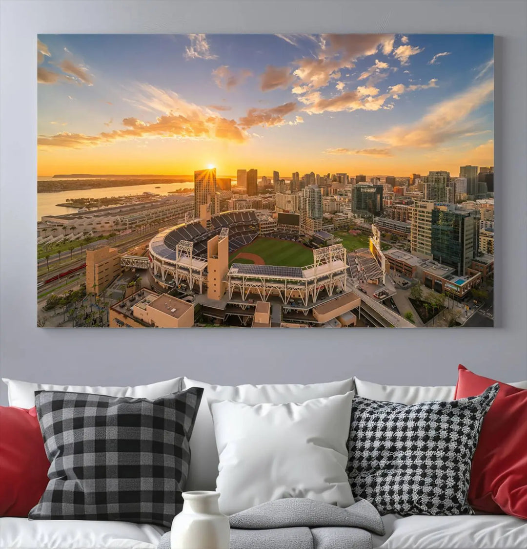 This Petco Park Sunset Triple Canvas Wall Art beautifully captures a vibrant San Diego cityscape at sunset, showcasing the iconic glow of Petco Park and high-rise buildings against a colorful sky.