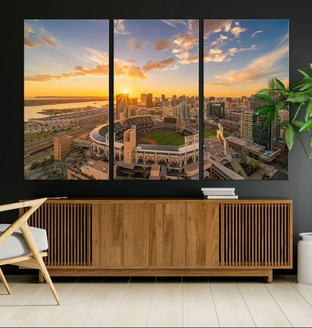 This Petco Park Sunset Triple Canvas Wall Art beautifully captures a vibrant San Diego cityscape at sunset, showcasing the iconic glow of Petco Park and high-rise buildings against a colorful sky.